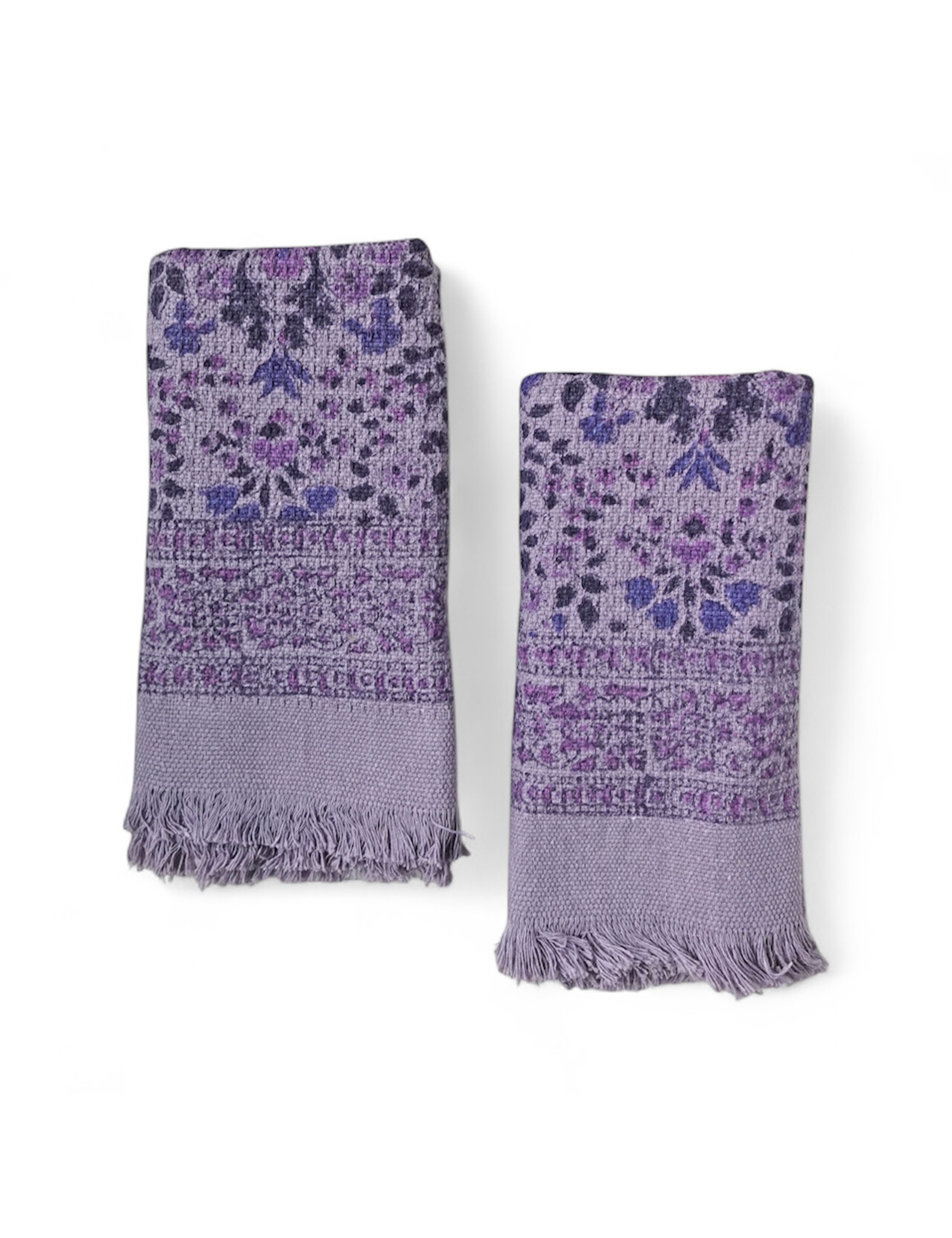 Two purple floral patterned hand towels on a white background