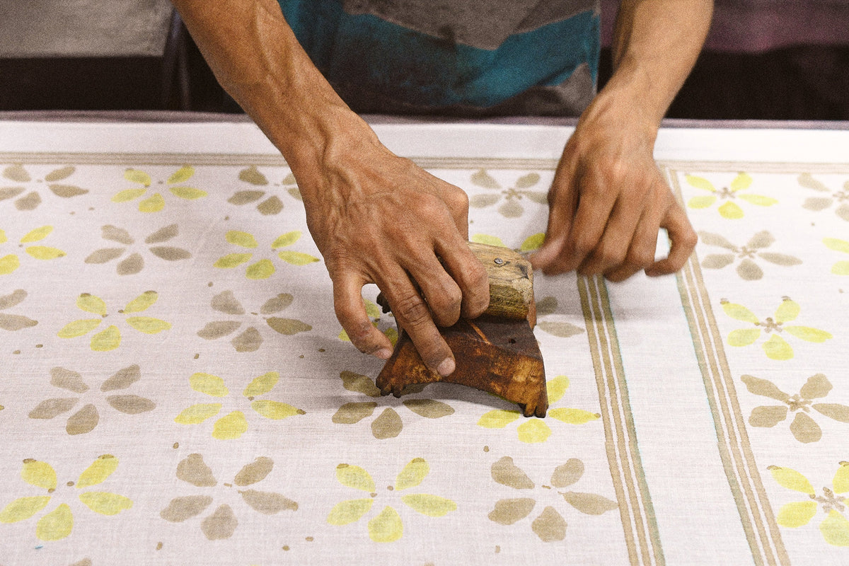 Artist block printing a bandana