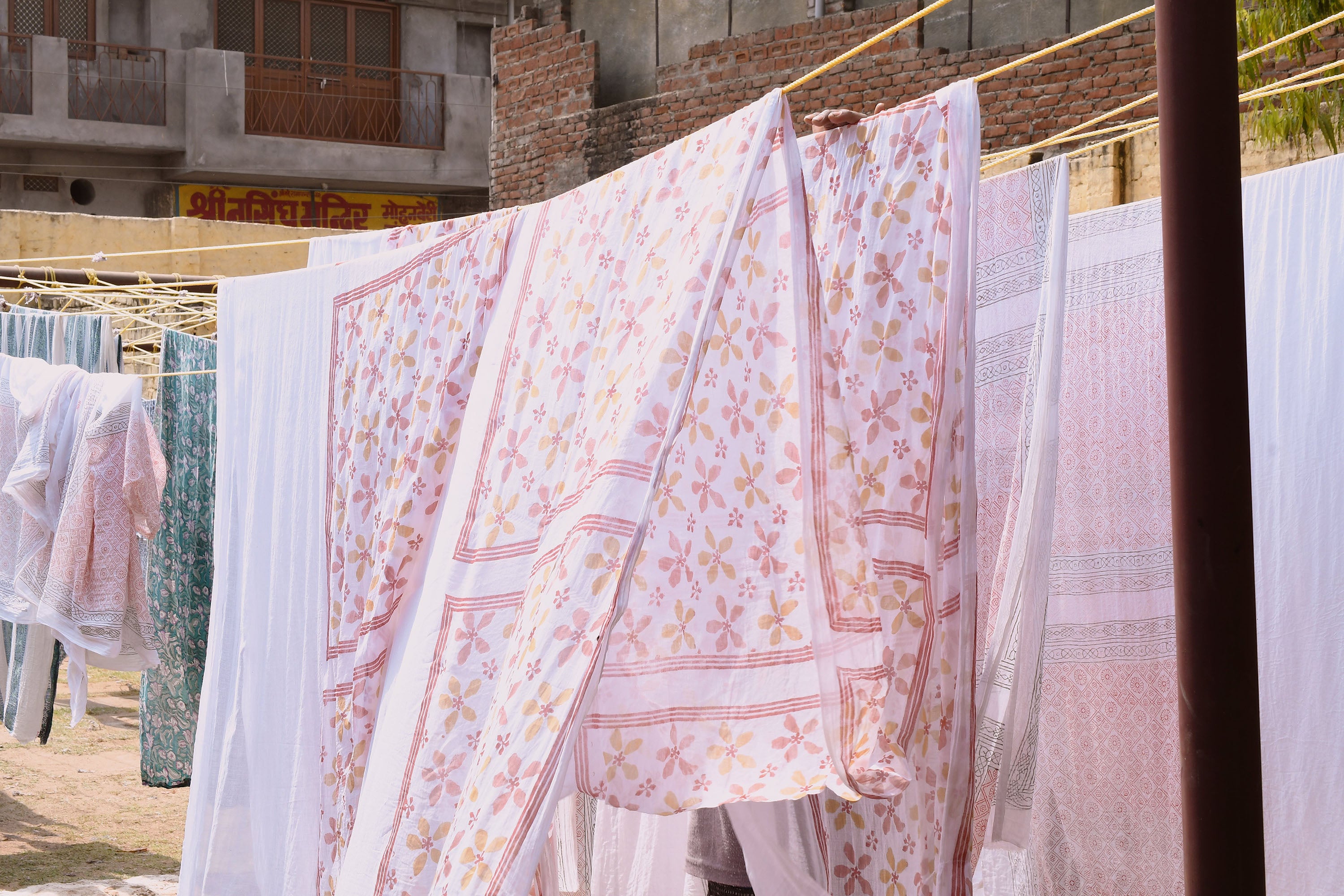 The Capri bandana printed fabric drying outside