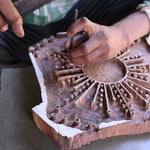 Video of hand carving the Astral print into a block of wood