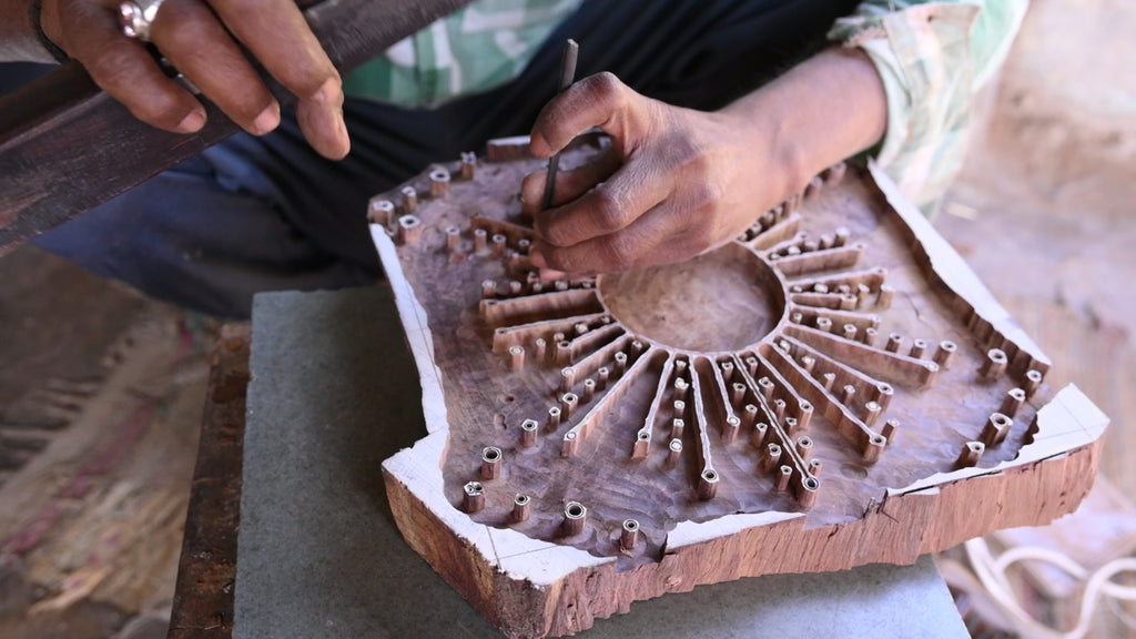 Video of hand carving the Astral print into a block of wood