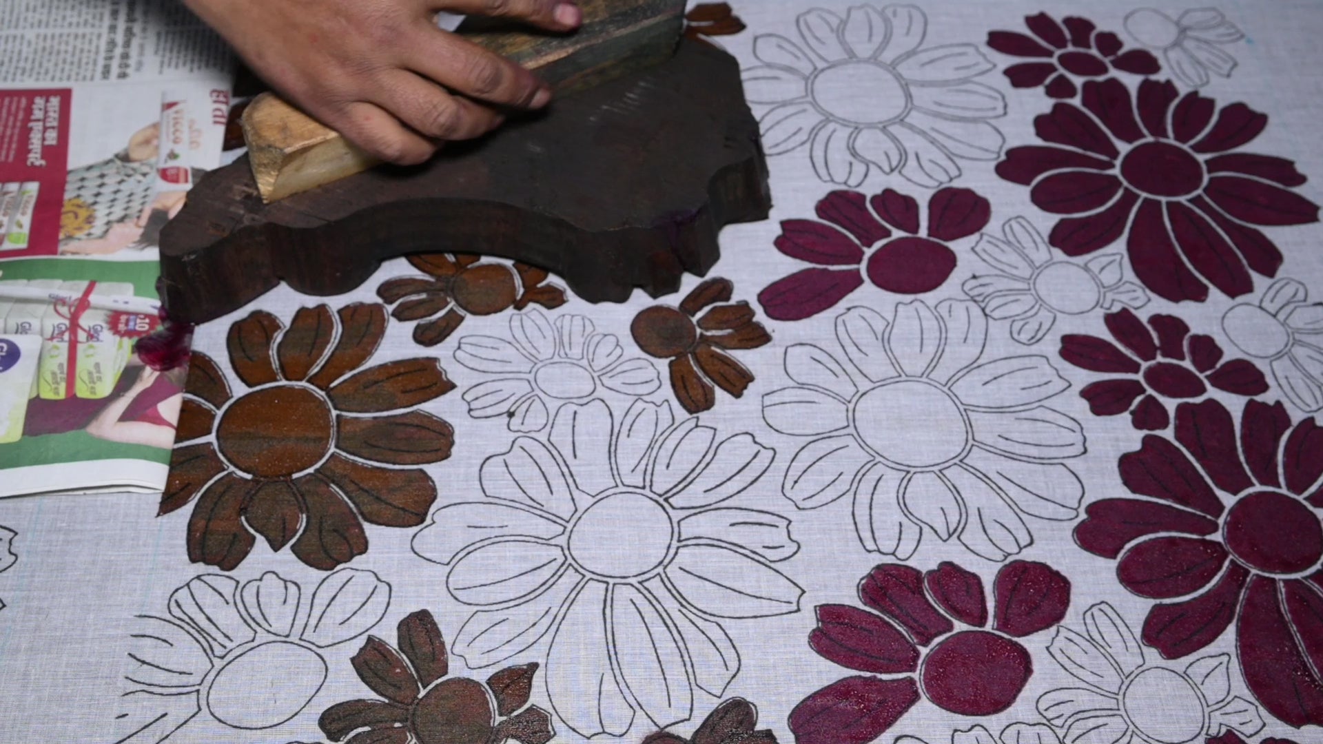 Artist block printing the color of the Flora bandana print