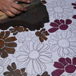 Artist block printing the color of the Flora bandana print