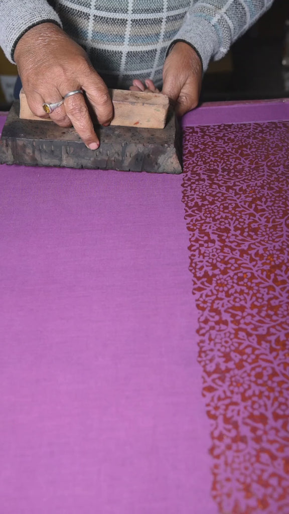 Artists block printing the Amber bandana