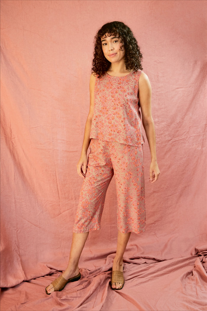 Model wearing the Birkin set, against a blush pink background