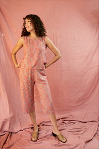 Model wearing the Birkin set, against a blush pink background