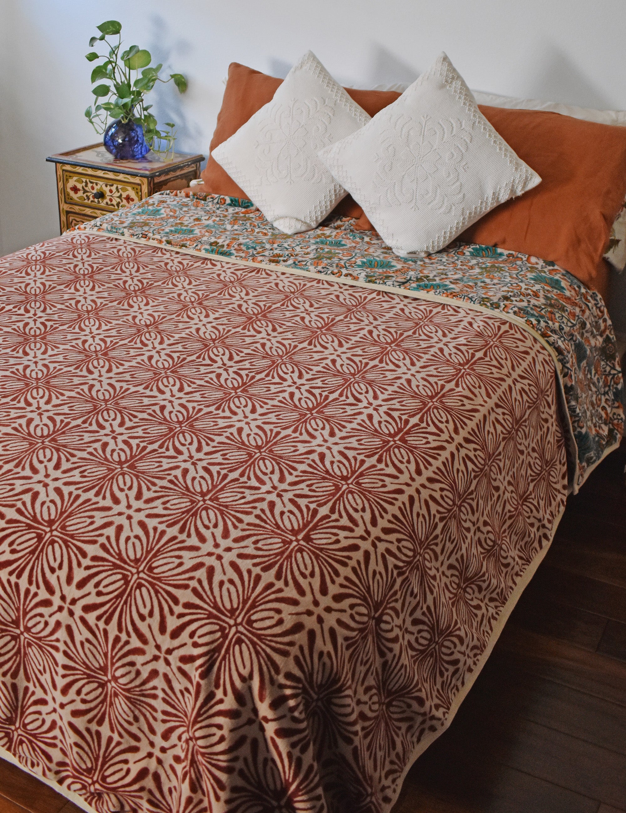 Never Leaving Home Reversible Velvet Blanket draping a full size bed, front print