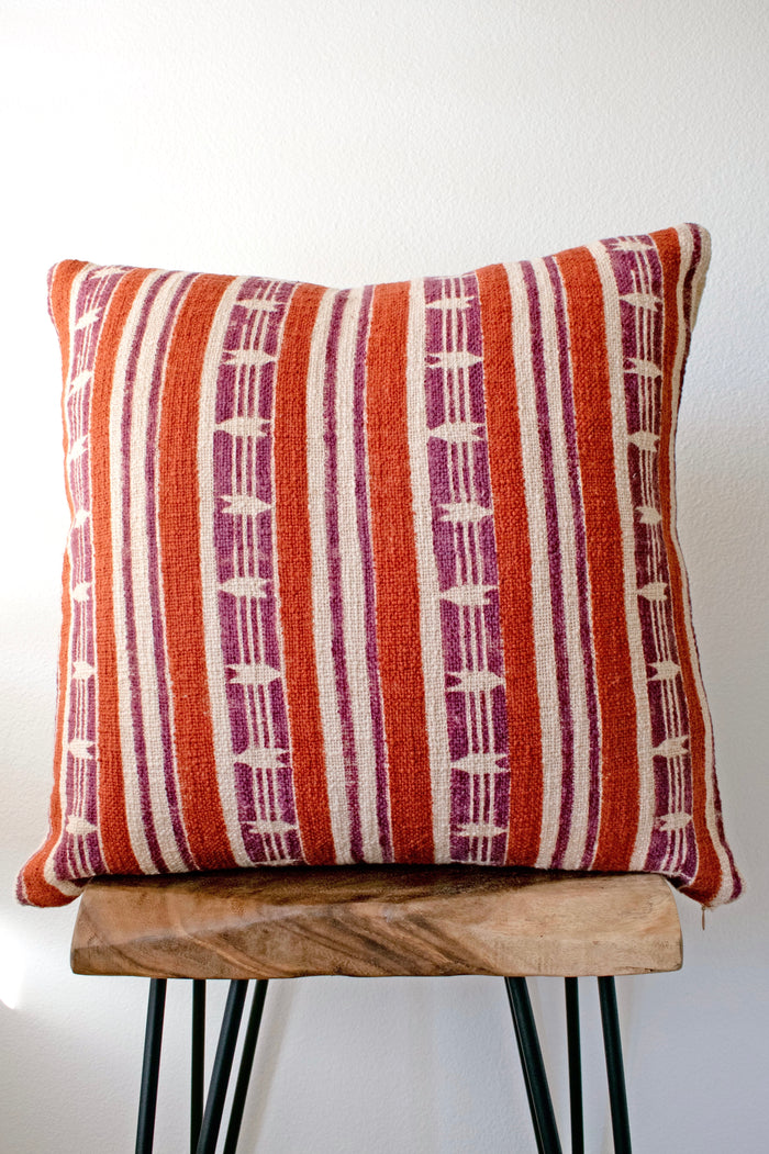 Mojave block print pillow on a stool against white